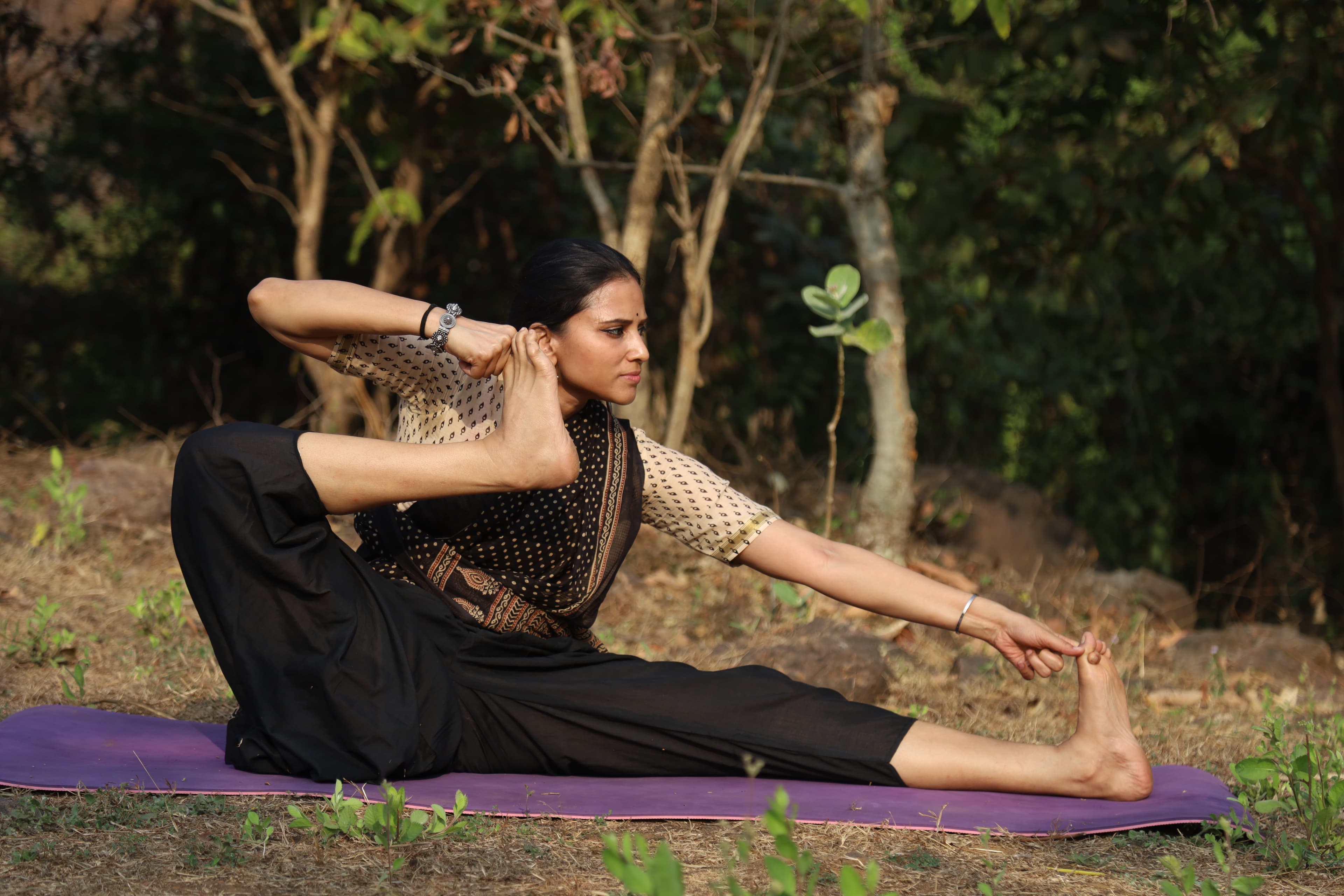 Suruchi Mittal performing a yoga asana outdoors